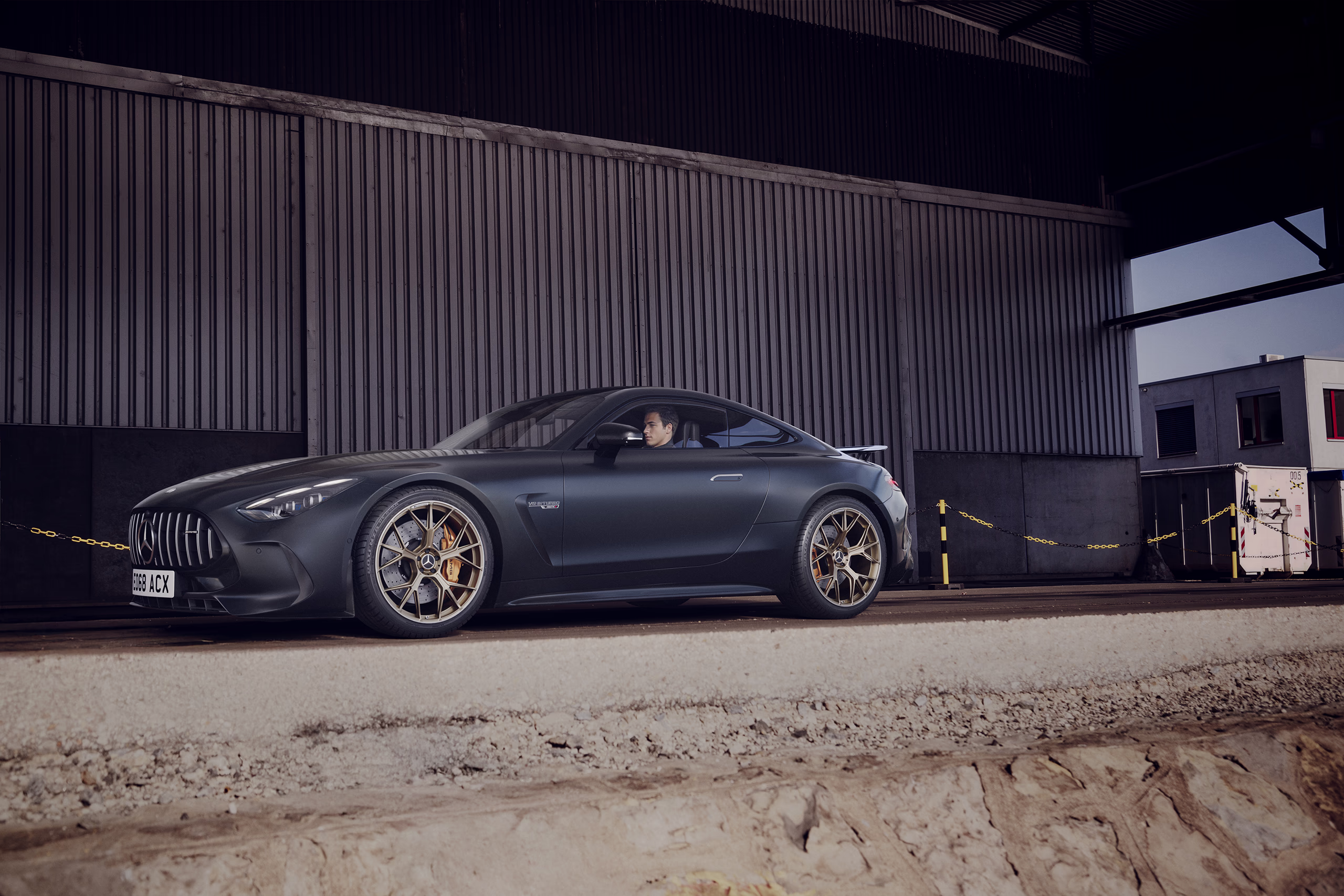 Mercedes AMG GT CGI visual in a dark industrial setting with cinematic lighting and realistic automotive reflections